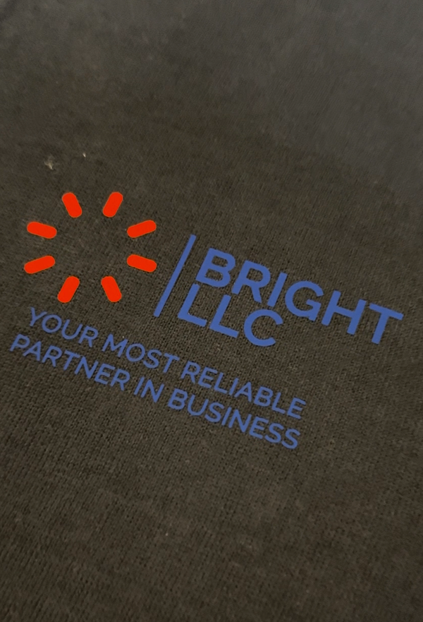 DTF print process — peel-off transfer revealing finished logo on garment